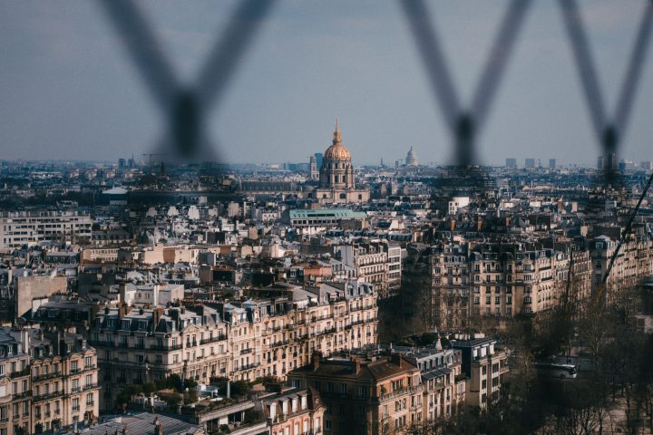 a-view-of-a-city-framed-by-a-fence